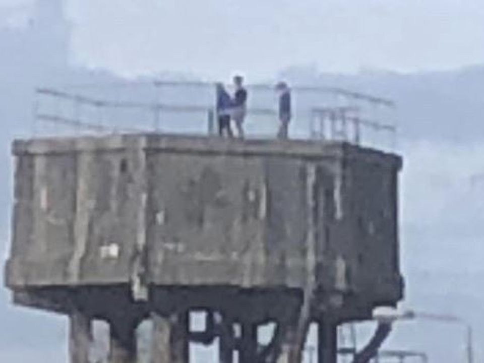 Kids on top of water tower