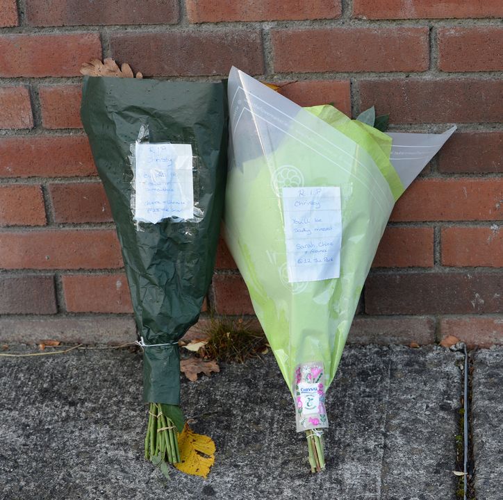 Flowers laid at the home where Christy Hall was killed