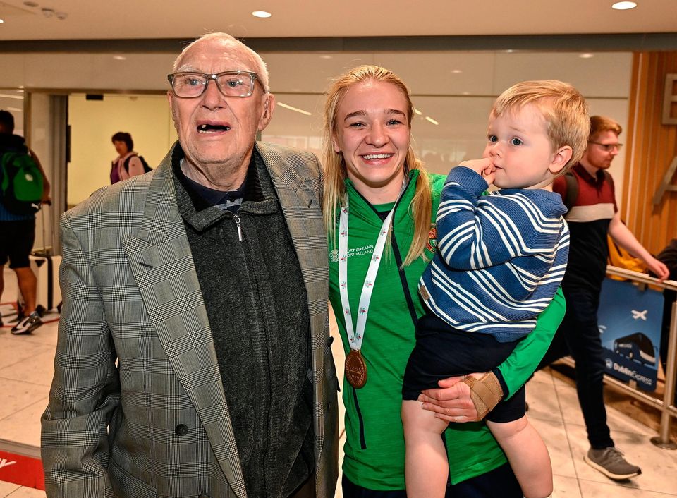 Amy Broadhurst of Ireland with her grandad Paddy Sands and nephew Zac Broadhurst at Dublin Airport on their return from the IBA Women's World Boxing Championships 2022 in Turkey. Photo by Oliver McVeigh/Sportsfile