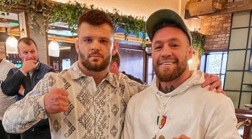 Conor McGregor poses in €1,705 D&G tracksuit with Moldovan fighter Kosti Gnusariov at The Black Forge Inn