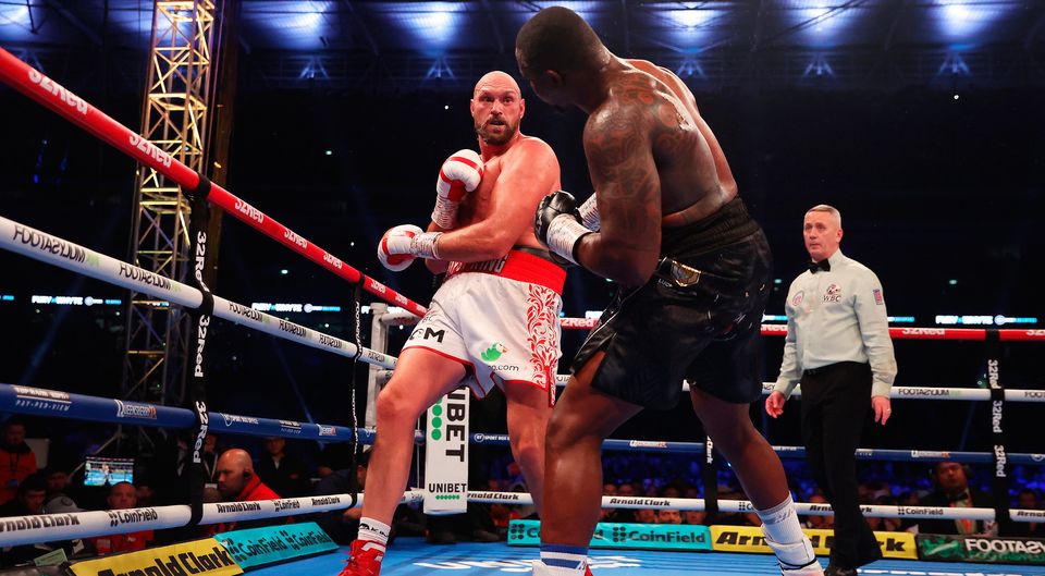Tyson Fury punches Dillian Whyte during the WBC World heavyweight fight