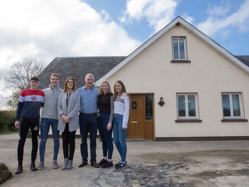 Martin Kenny and his wife and family pictured outside their County Leitrim home. Pic: Brian Farrell.