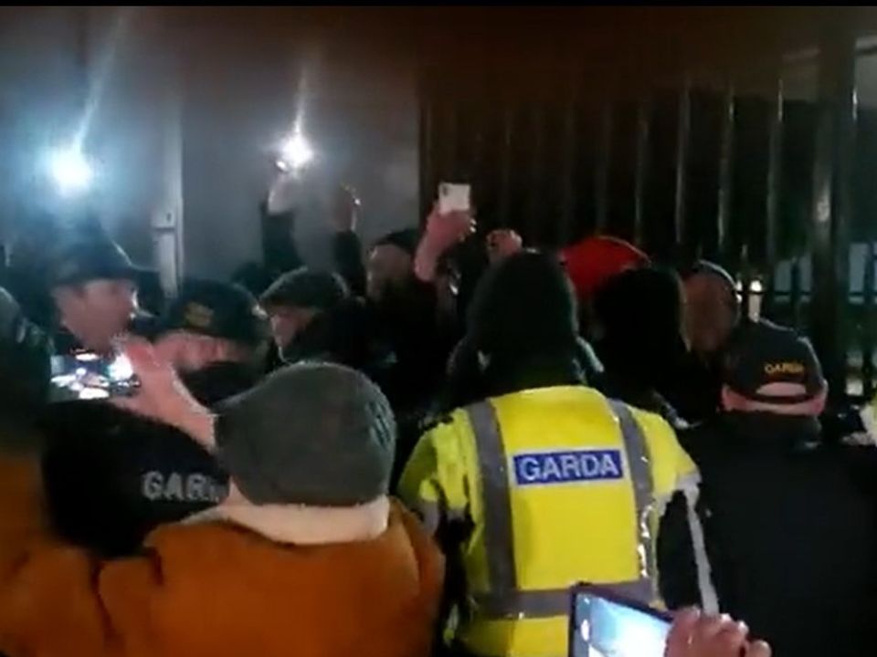 Gardai and protestors at the barracks gates