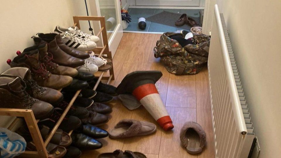 A traffic cone in the hallway of the couple's home after the incident
