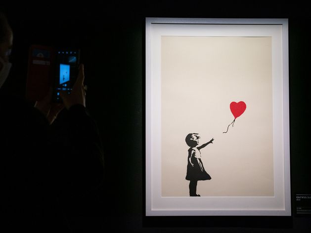 Two charged with burglary after Banksy painting stolen from London gallery