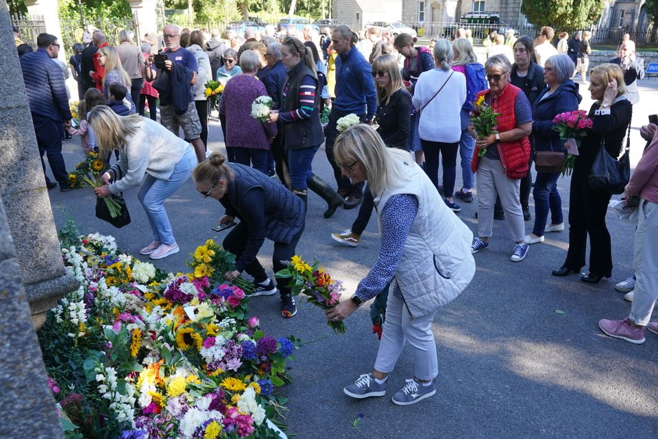 Well-wishers outside Balmoral in Scotland following the death of Queen Elizabeth II on Thursday. Picture date: Saturday September 10, 2022.