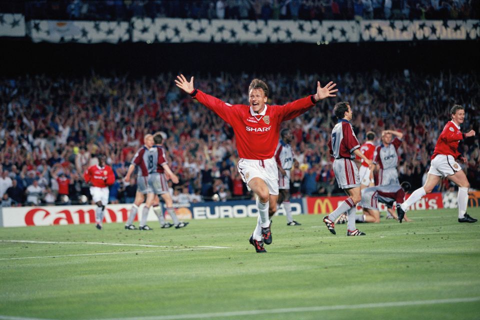 Sheringham after scoring in 1999