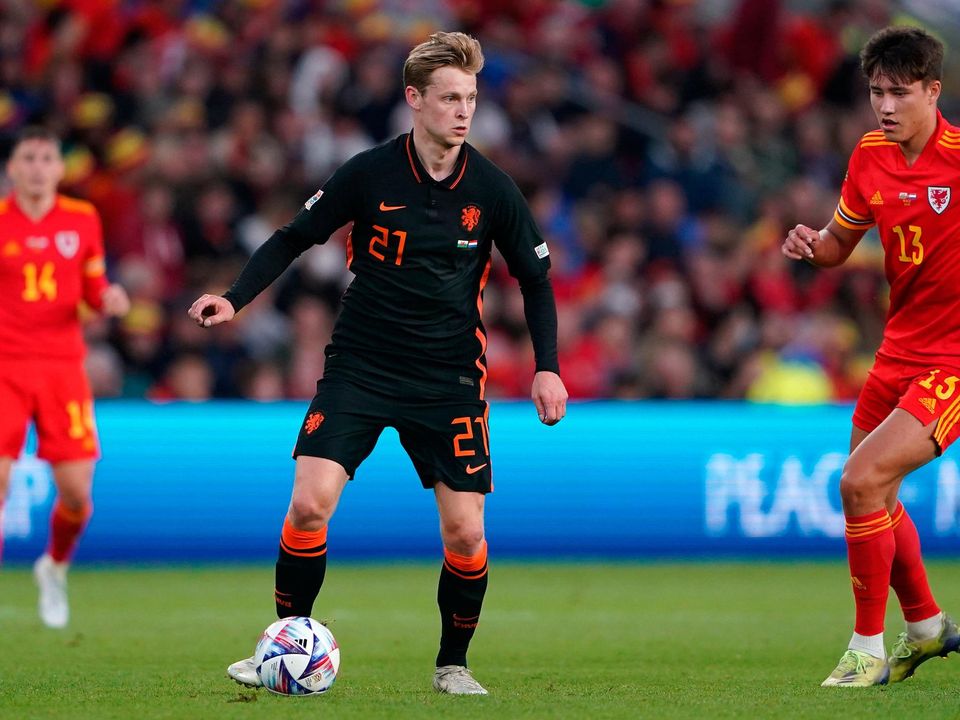 Netherlands' Frenkie de Jong (centre) in action with Wales' Rubin Colwill during the UEFA Nations League match at the Cardiff City Stadium, Cardiff. Photo: PA Photo