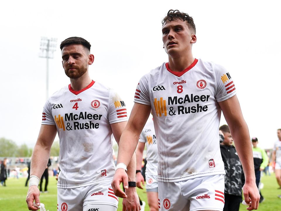 Pádraig Hampsey, left, and Conn Kilpatrick leave the field after the loss to Derry. Photo by David Fitzgerald/Sportsfile