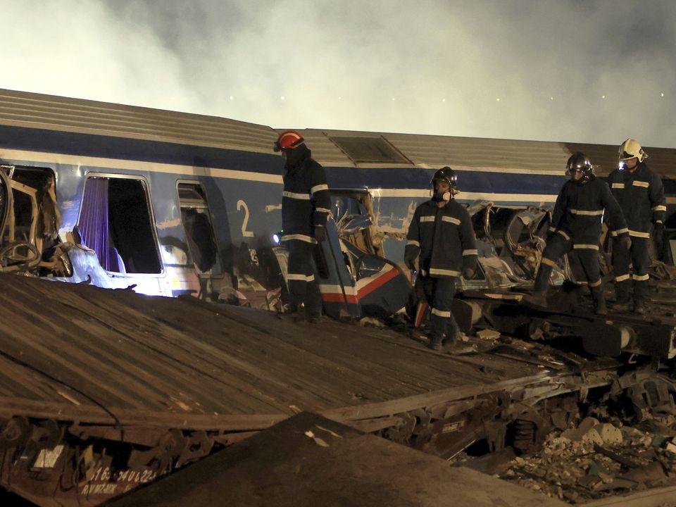 A train carrying hundreds of passengers collided with an oncoming freight train in northern Greece, killing and injuring dozens passengers (George Kidonas/InTime News/AP)