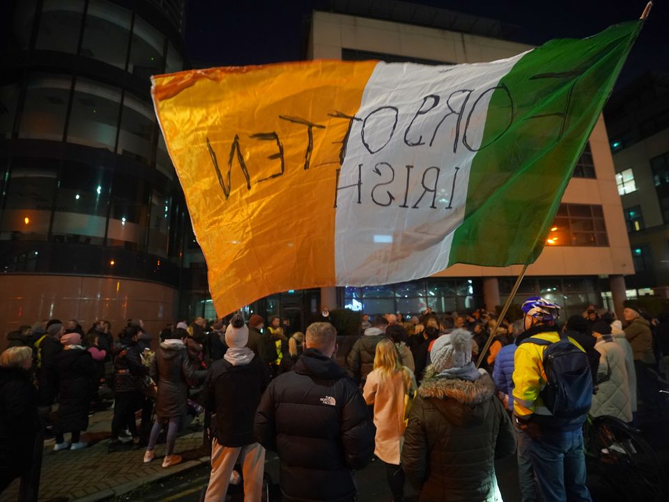 Members of the public march on Dublin Port following the housing of some 100 migrants at the former ESB office block in East Wall, Dublin