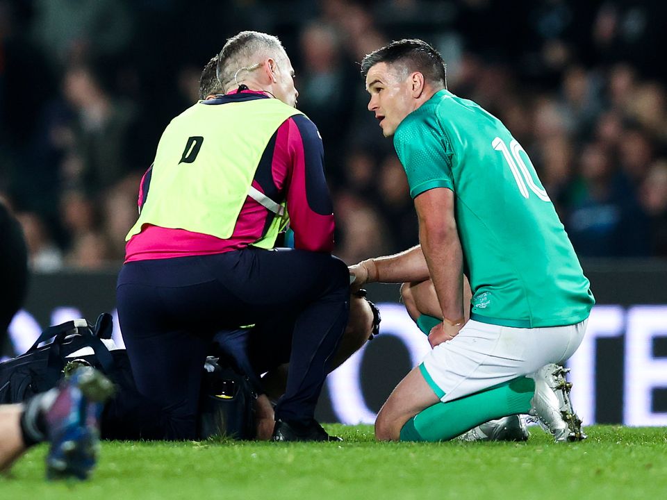 Big blow: Ireland captain Johnny Sexton receives treatment before leaving the field at Eden Park