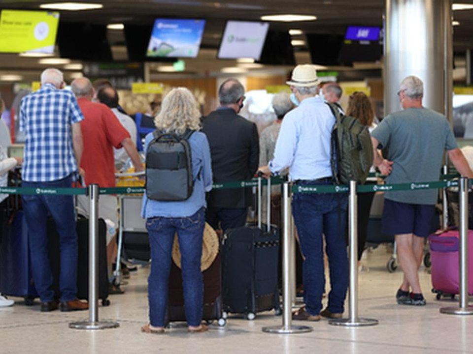 Passengers queuing at Dublin Airport. Photo: Liam McBurney/PA