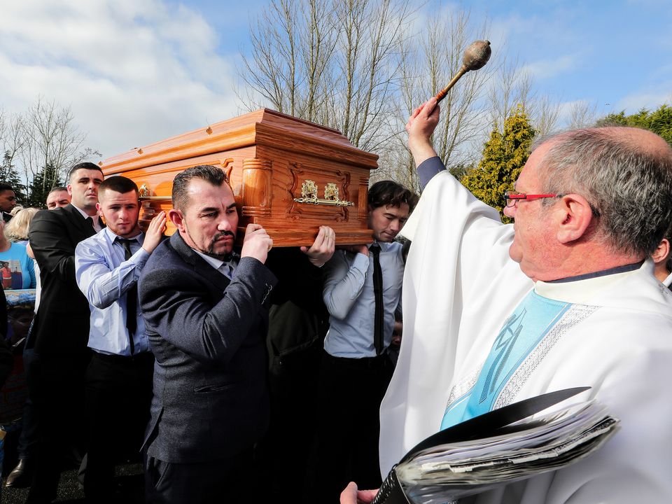 Fr. Kevin Blade blesses the remains of John Kennan Sammon as they arrive for funeral mass at The Church of the Resurrection in Galway. Picture; Gerry Mooney