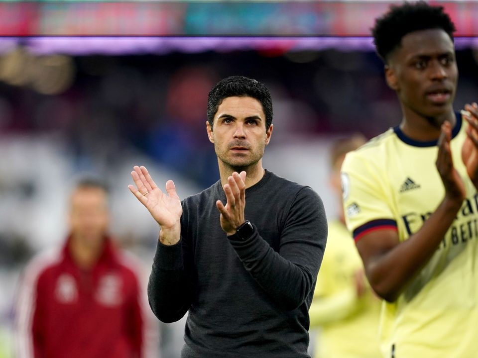 Mikel Arteta and his team applaud the fans at full-time (John Walton/PA)