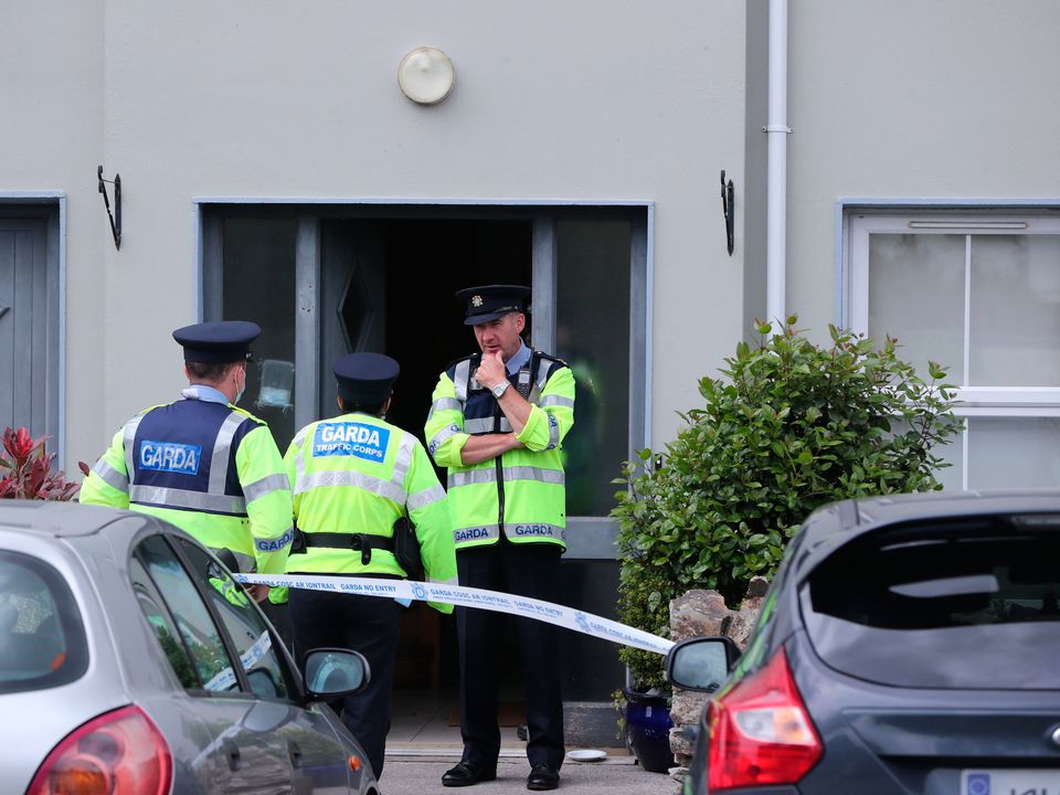 Gardaí at the house in Clashmore, Co Waterford, where Mia O'Connell died. PA