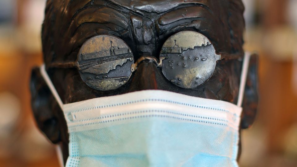 A statue of James Joyce with a Covid-19 face mask (Niall Carson/PA)