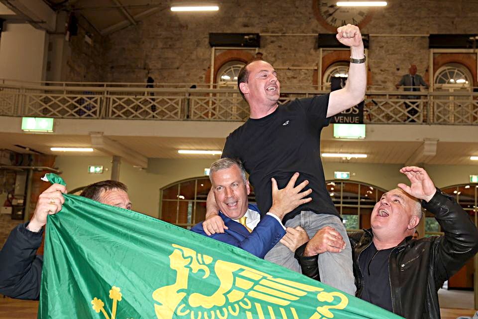 Gavin Pepper is elevated by Hermann Kelly, left, of the Ireland Freedom Party. Photo: Eamonn Farrell