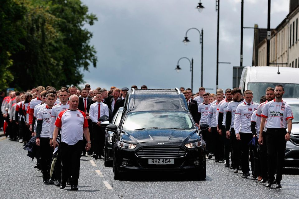 The cortege as it arrives at St Patrick's Church, Dungannon, County Tyrone, for the funeral for GAA star Damian Casey, following the death of the Tyrone hurling captain was attending a friend's wedding in Spain when he died in an incident in a swimming pool last week. Picture date: Sunday June 26, 2022. PA Photo. See PA story ULSTER Casey. Photo credit should read: Liam McBurney/PA Wire
