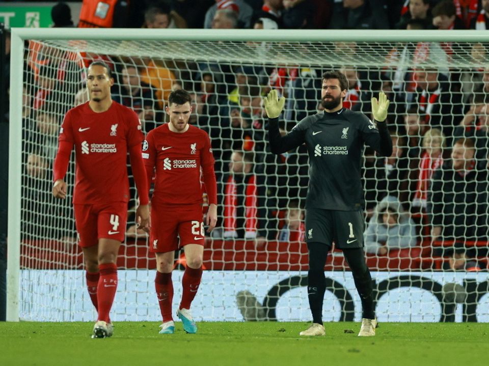 Liverpool's Alisson looks dejected after Real Madrid's Karim Benzema scores their fifth goal
