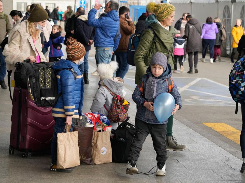 Ukrainian refugees fleeing the war pictured earlier this year in Warsaw