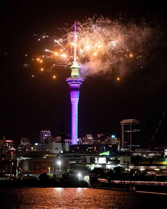 Fireworks explode over Sky Tower in central Auckland as New Year celebrations begin in New Zealand