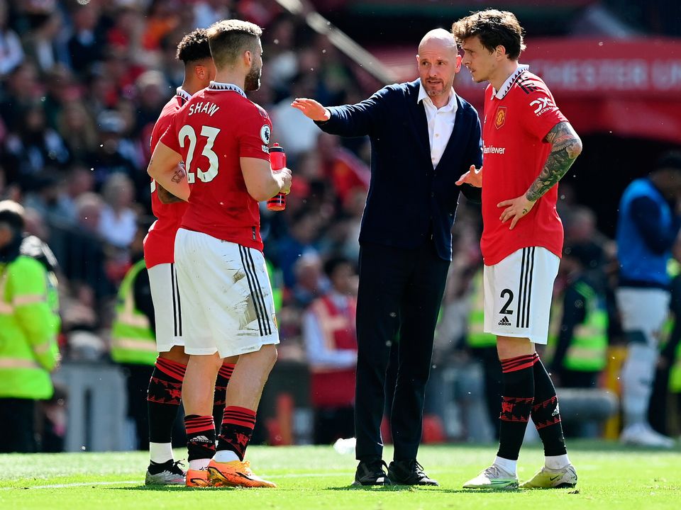 MANCHESTER, ENGLAND - MAY 13: Erik ten Hag, Manager of Manchester United, speaks with Jadon Sancho (obscured), Luke Shaw and Victor Lindelof of Manchester United during the Premier League match between Manchester United and Wolverhampton Wanderers at Old Trafford on May 13, 2023 in Manchester, England. (Photo by Michael Regan/Getty Images)