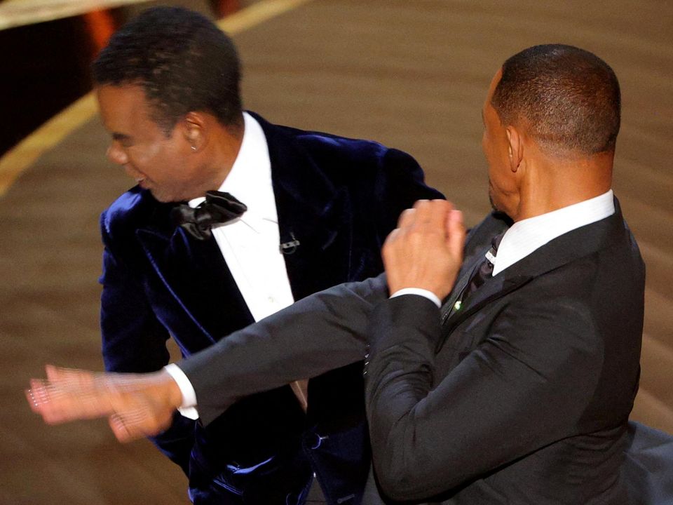 Will Smith hits Chris Rock on stage during the Oscars in Hollywood, Los Angeles, US, March 27, 2022. Picture by REUTERS/Brian Snyder