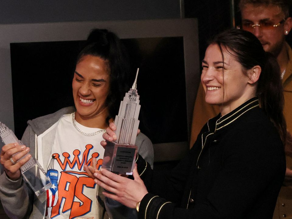 Boxers Katie Taylor and Amanda Serrano smile after lighting the Empire State Building promoting their world lightweight championship fight in New York City. REUTERS/Shannon Stapleton