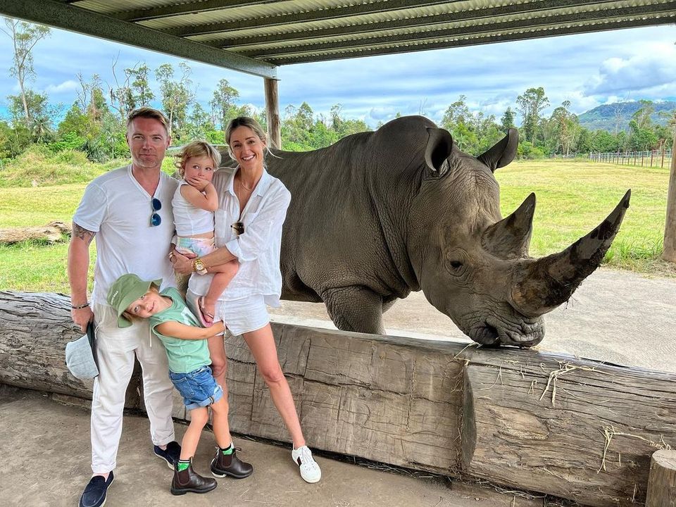 Ronan, Storm, Coco, and Cooper with a rhinoceros at Australia Zoo