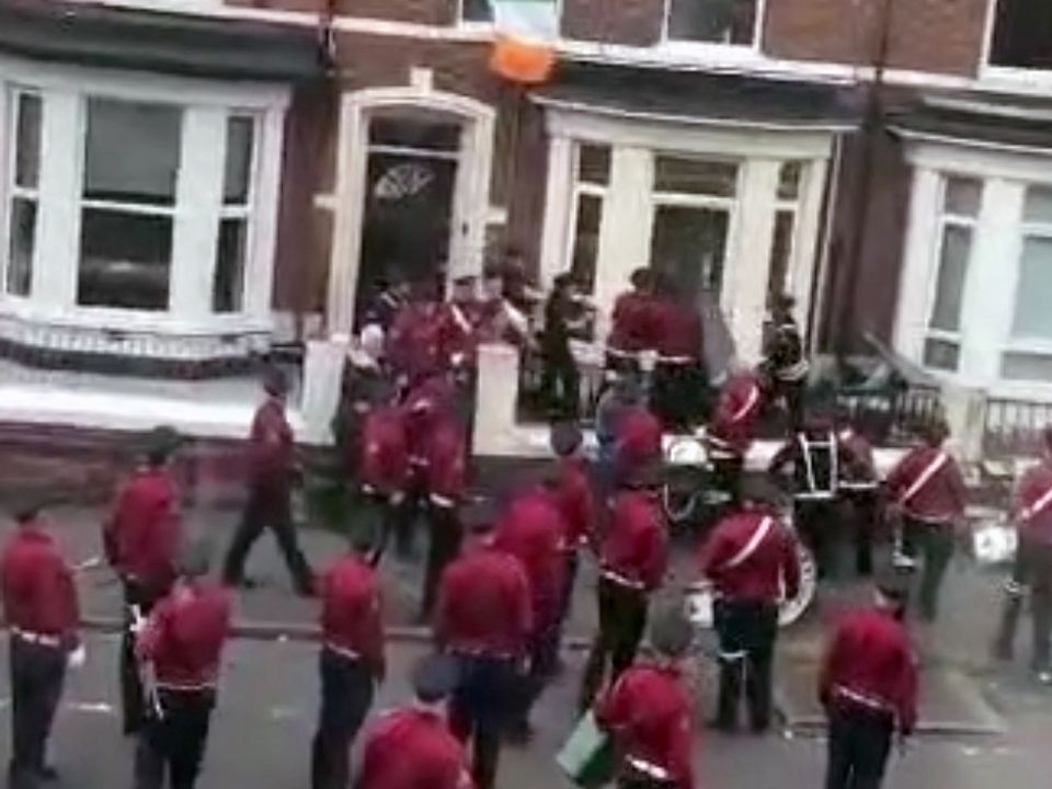An Orange flute band had a bin hurled at them while marching through Agincourt Avenue on the 12th of July.