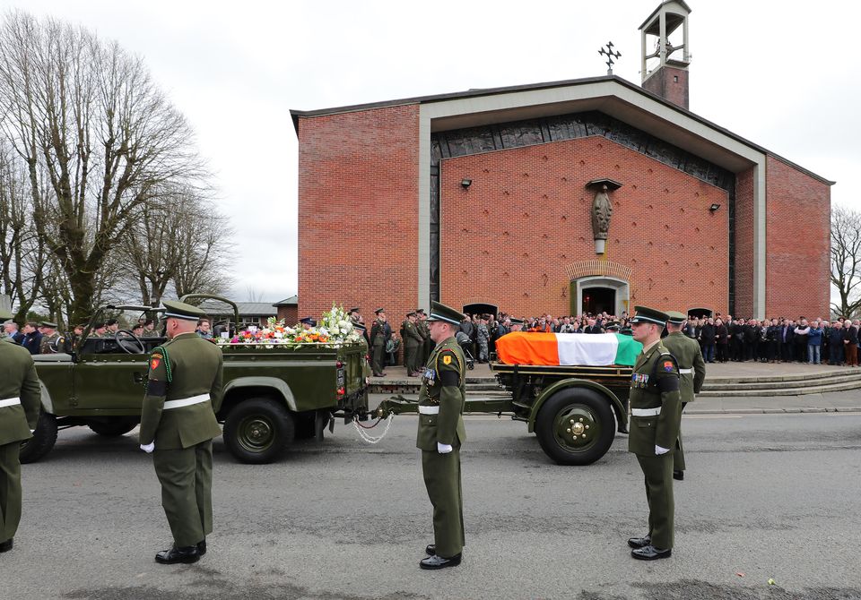 The remains of Acting Sergeant Major Declan O'Connell are taken away following his funeral mass in St Brigids Church in the Curragh Camp . Picture; Gerry Mooney