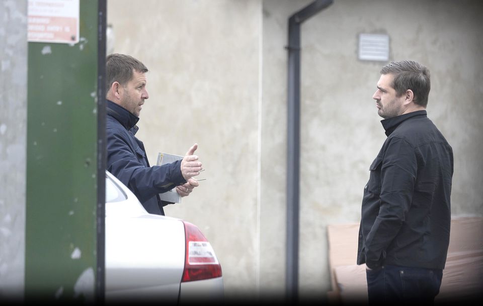 Anthony Behan (Left) talking to reporter Alan Sherry (right) at his garage. Photo: Gary Ashe