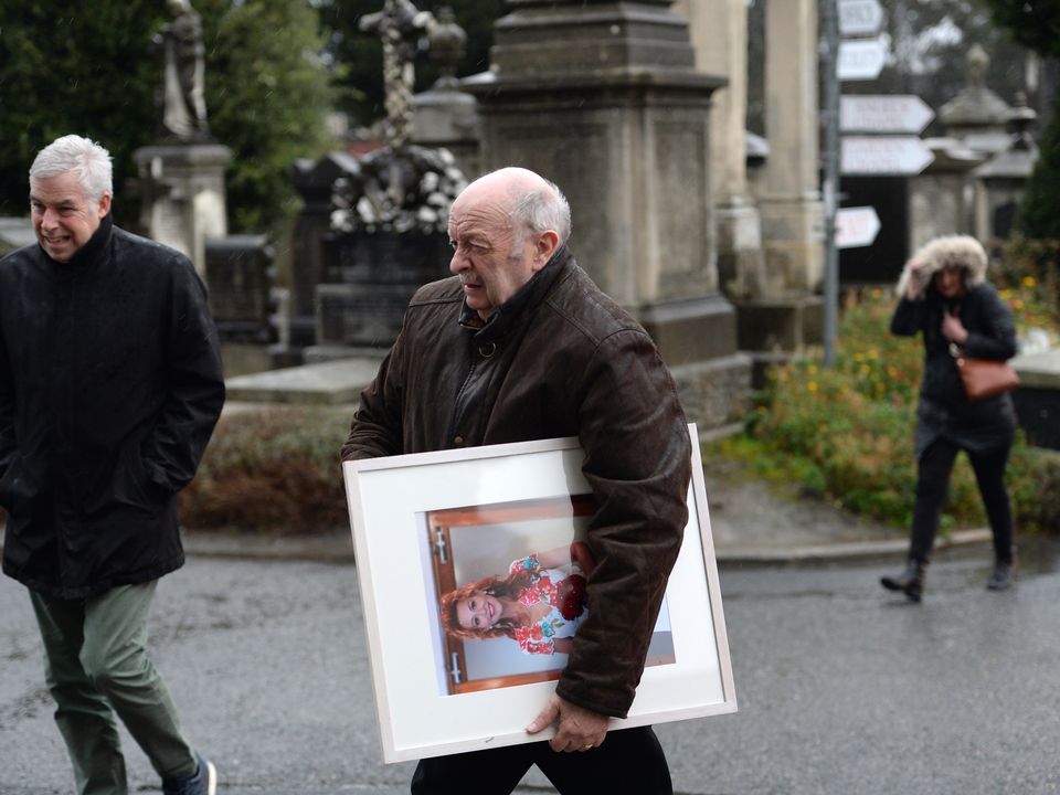 Fair City star Mick Nolan carrying a photo of his wife Carol Anne Lowe at her funeral this afternoon. Photo: Ernie Leslie