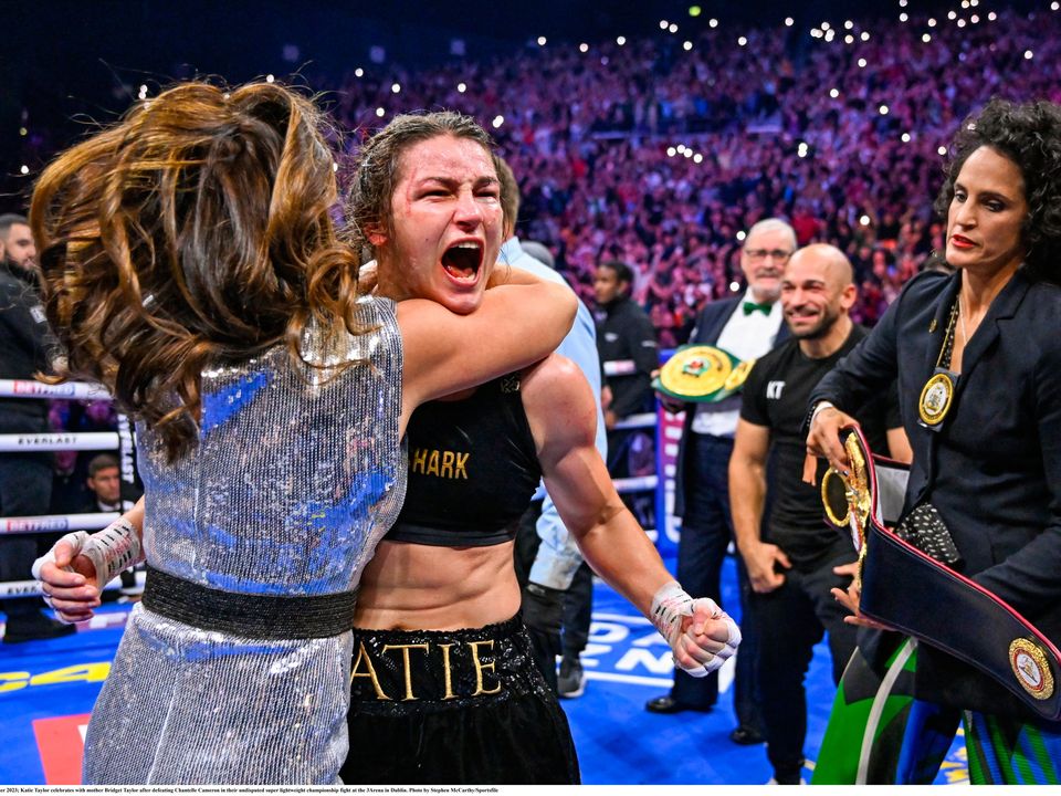 25 November 2023; Katie Taylor celebrates with mother Bridget Taylor after defeating Chantelle Cameron in their undisputed super lightweight championship fight at the 3Arena in Dublin. Photo by Stephen McCarthy/Sportsfile