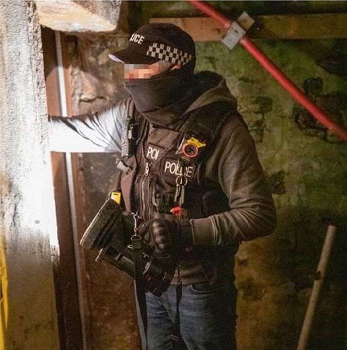 A police officer during the raid on the cannabis farm