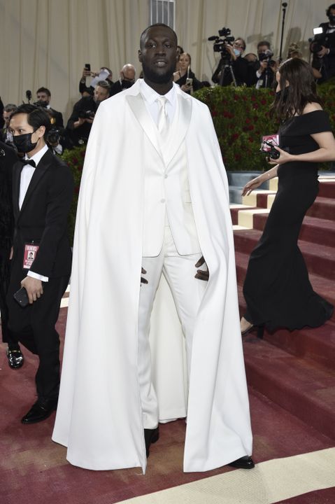 British rapper Stormzy wore an all white Burberry suit with a matching ling, white cape, which he acknowledged was not his usual look (Evan Agostini/AP)