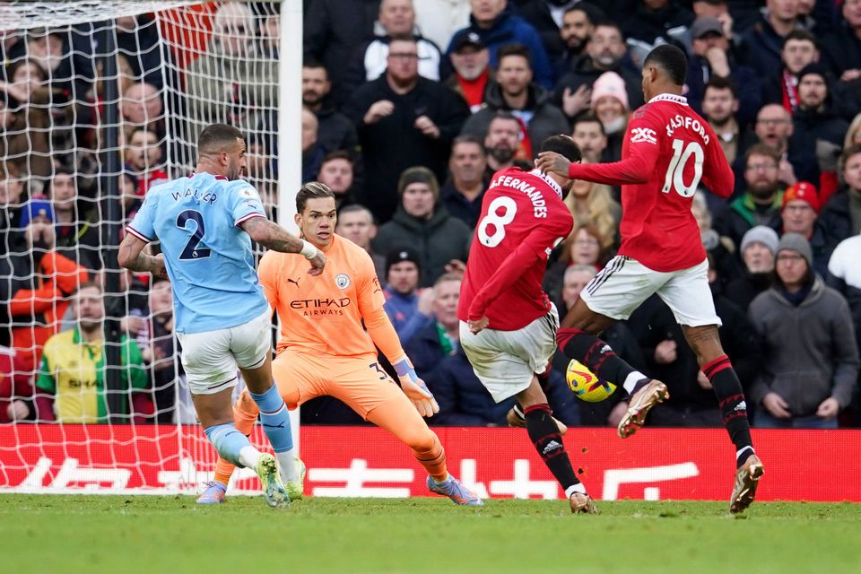 Manchester United's Bruno Fernandes scores his side's first goal during the English Premier League soccer match between Manchester United and Manchester City at Old Trafford in Manchester, England, Saturday, Jan. 14, 2023. (AP Photo/Dave Thompson)
