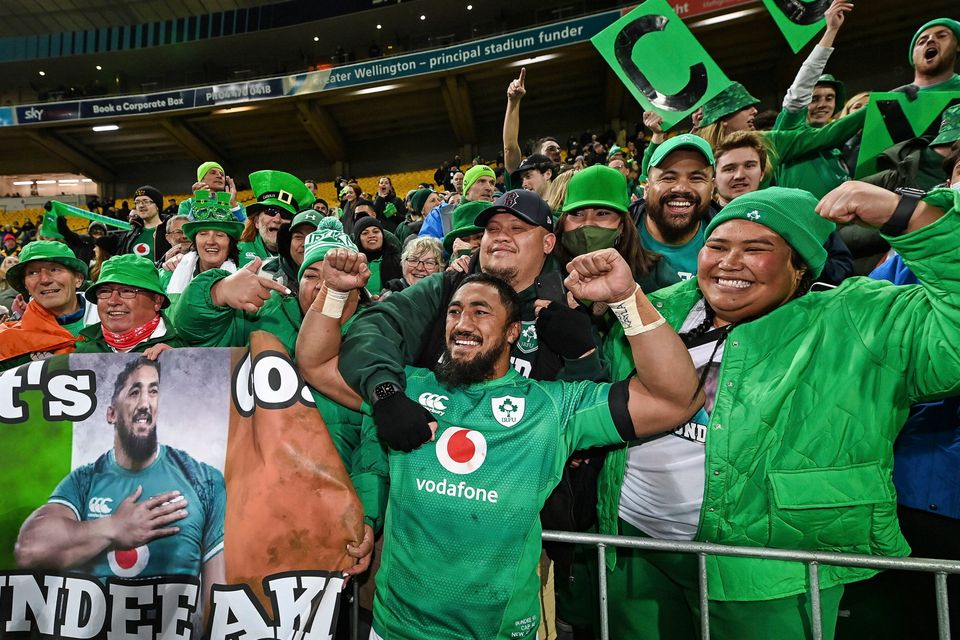 Ireland's Bundee Aki celebrates with supporters following the third rugby international between the All Blacks and Ireland in Wellington, New Zealand, Saturday, July 16, 2022. (Andrew Cornaga/Photosport via AP)