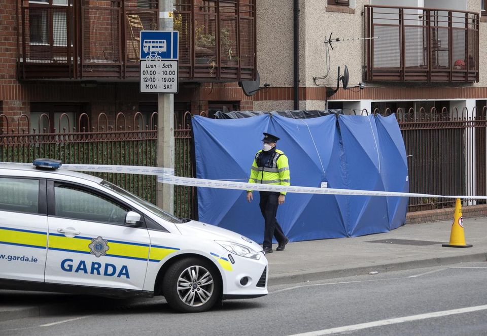 A garda outside the apartment at Robinson’s Court, Cork Street, where Mr Kwok Ping Cheng's body was found (Picture: Colin Keegan, Collins Dublin)