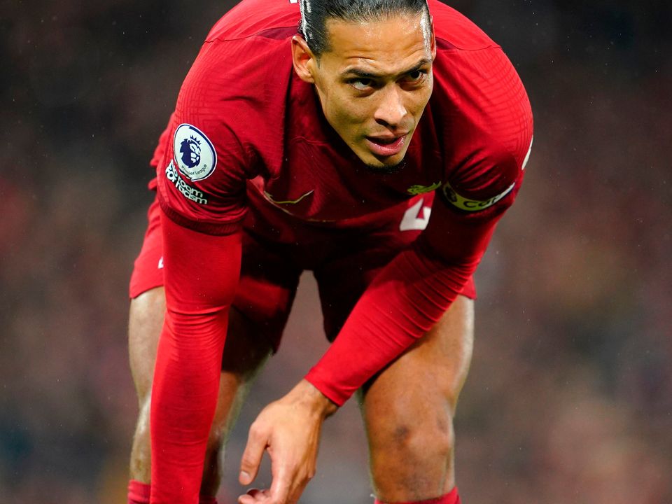 Liverpool's Virgil van Dijk holds his shin during the Premier League match at Anfield, Liverpool. Picture date: Wednesday March 1, 2023. PA Photo. See PA story SOCCER Arsenal. Photo credit should read: Peter Byrne/PA Wire.

RESTRICTIONS: EDITORIAL USE ONLY No use with unauthorised audio, video, data, fixture lists, club/league logos or "live" services. Online in-match use limited to 120 images, no video emulation. No use in betting, games or single club/league/player publications.