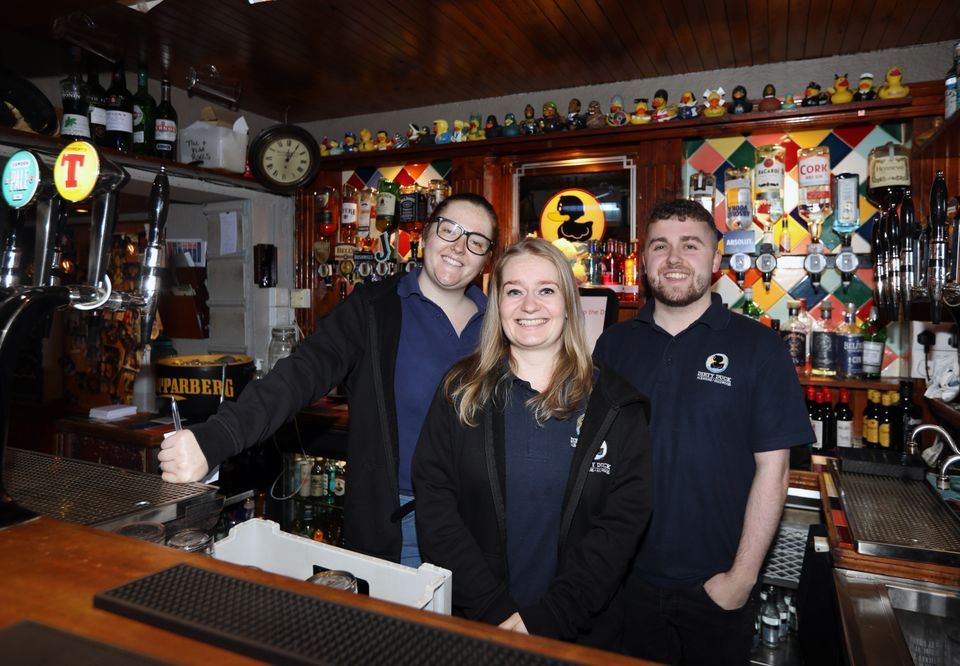 Rachel Woods behind the bar with colleagues