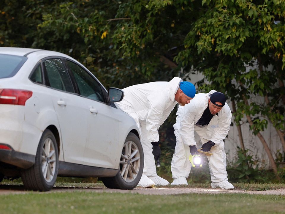 A police forensics team investigates a crime scene after multiple people were killed and injured in a stabbing spree in Weldon, Saskatchewan, Canada. Photo: REUTERS/David Stobbe