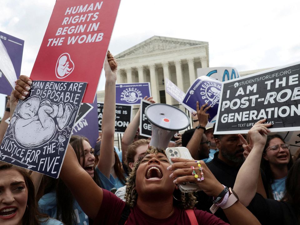 Anti-abortion demonstrators celebrate outside the US Supreme Court after it overturned the landmark Roe v Wade abortion decision in Washington, US. Photo: Evelyn Hockstein/Reuters