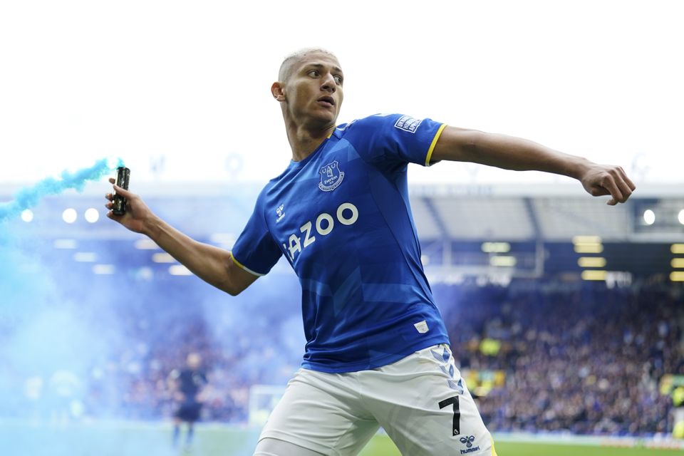 Richarlison threw a smoke canister back into the Gwladys Street end after breaking the deadlock (Jon Super/AP)