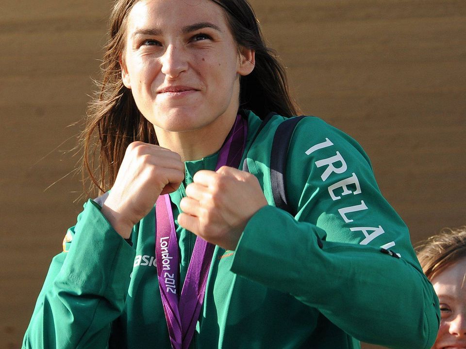 13 August 2012; Olympic champion Katie Taylor celebrates with her gold medal for boxing on her arrival home from the London 2012 Olympic Games. Bray, Co. Wicklow. Picture credit: Pat Murphy / SPORTSFILE
