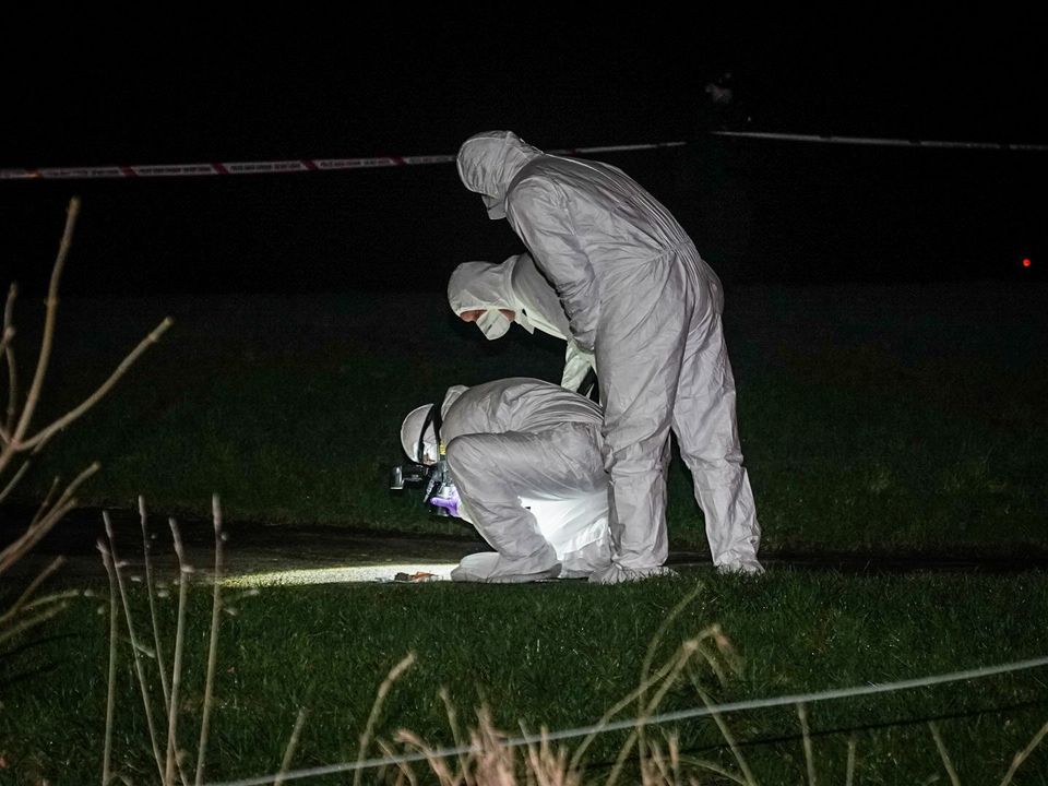 Forensic officers at the scene of the Derry shooting