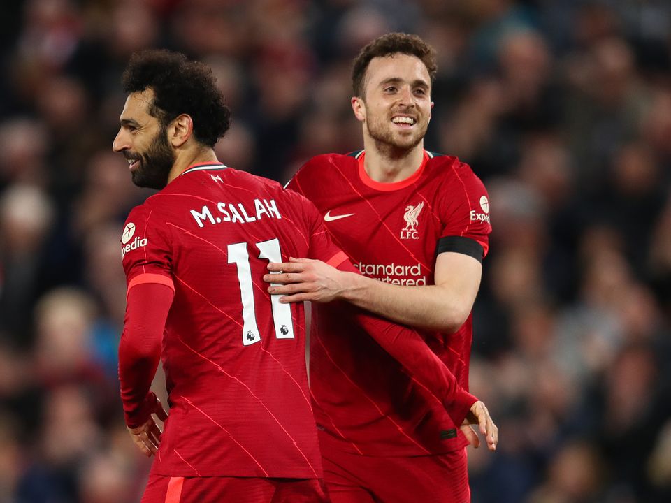LIVERPOOL, ENGLAND - APRIL 19: Mohamed Salah of Liverpool celebrates scoring his side's fourth goal with team-mate Diogo Jota during the Premier League match between Liverpool and Manchester United at Anfield on April 19, 2022 in Liverpool, England. (Photo by Chris Brunskill/Fantasista/Getty Images)