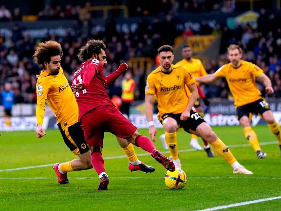 Liverpool's Mohamed Salah attempts a shot on goal during the Premier League match at Molineux Stadium, Wolverhampton. Picture date: Saturday February 4, 2023. PA Photo. See PA story SOCCER Wolves. Photo credit should read: Tim Goode/PA Wire.

RESTRICTIONS: EDITORIAL USE ONLY No use with unauthorised audio, video, data, fixture lists, club/league logos or "live" services. Online in-match use limited to 120 images, no video emulation. No use in betting, games or single club/league/player publications.