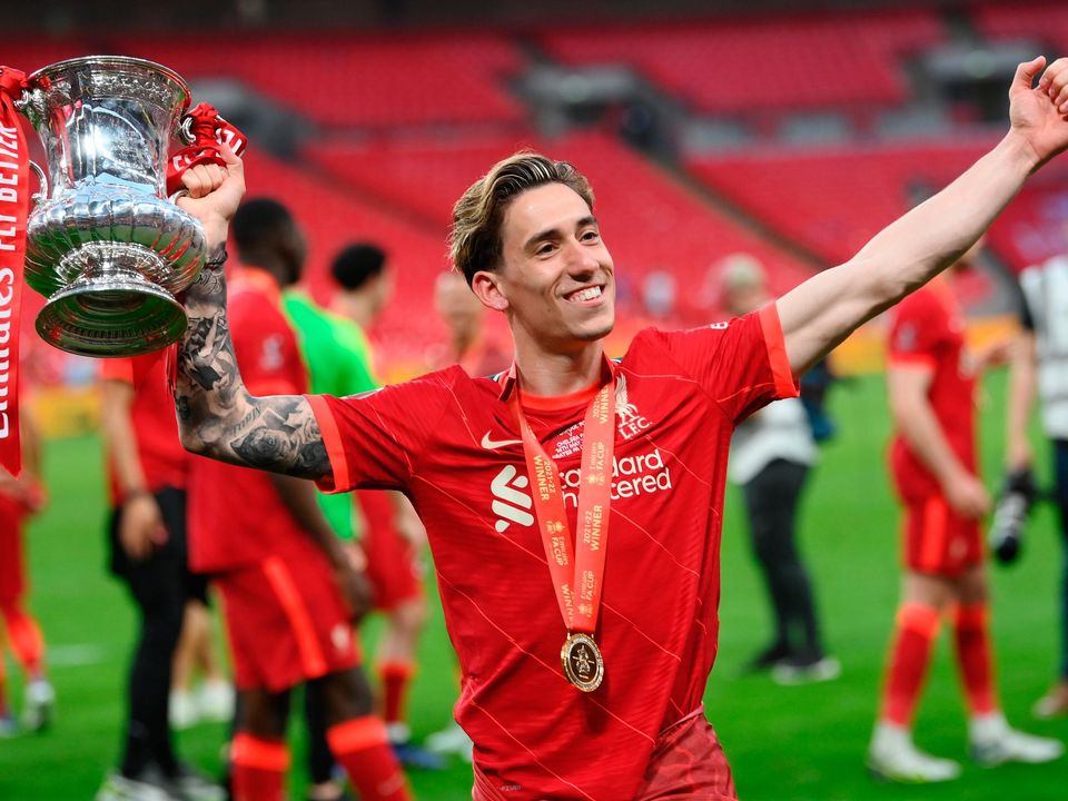 Kostas Tsimikas of Liverpool celebrates with the FA Cup after his side's victory. Photo by Mike Hewitt/Getty Images